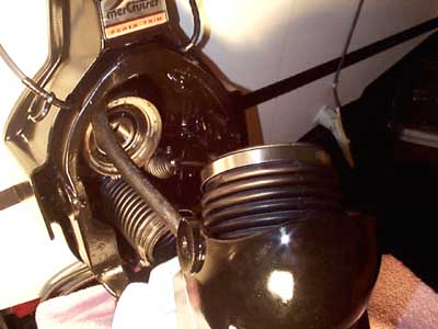 The water pipe is poked through it's hole and the bushing will be installed from inside the boat.