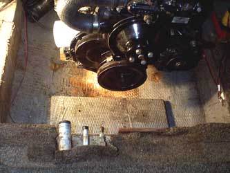 The front support is removed with the engine dangling from a hook.