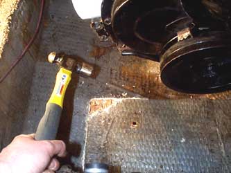 Chopping away at the fiberglass.