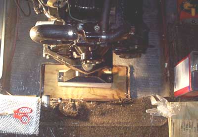 The first few layers are in place and the motor is sitting on them to hold them flat while the resin cures.